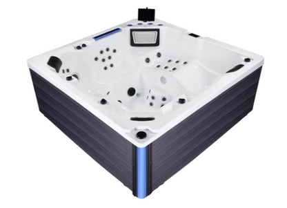 BuenoSpa Denver Hot Tub in white acrylic with dark gray cabinet and blue LED corner accent, featuring built-in jets, headrests, and an integrated tablet holder — tablet shown for display purposes only, not included with purchase.